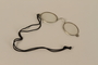 Pince-nez with black cord given to a Jewish American soldier  by survivors of the Łódź ghetto