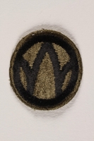 2004.749.26 front
US Army 89th Infantry Division shoulder sleeve patch with a black W monogram on a green field

Click to enlarge