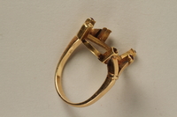 2008.198.2 front
Gold ring with pink stones received by a refugee in a displaced persons camp upon the birth of her daughter

Click to enlarge
