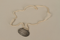 2008.319.4 back
Identification tag with name and birthdate issued to a Jewish refugee child

Click to enlarge