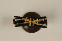 1988.156.1.1 front
World War I Honor & Iron Crosses buttonhole ribbon bar with Combatant’s swords awarded to a German Jewish soldier

Click to enlarge