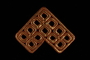 Metallic bronze tallit decoration of entwined squares brought with a Polish Jewish emigre