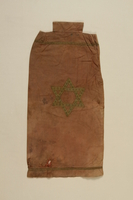 1990.41.20 front
Brown cloth Torah mantle with a Star of David applique

Click to enlarge