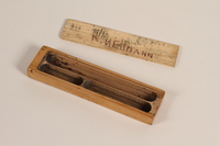 1990.44.33 other
Wooden sliding lid pencil box with a rose decal used by a student in Nazi Germany

Click to enlarge