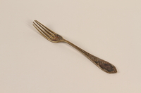 2008.228.19 front
Silver floral patterned dinner fork used by an inmate in a slave labor camp

Click to enlarge