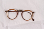 Plastic eyeglass frames, temple and lenses worn by a Jewish concentration camp inmate