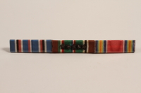 2003.149.9 front
Ribbon bar with 3 campaign ribbons issued to a Jewish German US soldier

Click to enlarge