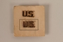 Copper colored U.S. lapel pin received by a German Jewish US soldier
