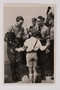 Cigarette card photo of a smiling Hitler with roses and a Hitler Youth member