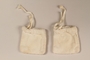 White plush hand coverings worn by a Jewish infant while living in hiding
