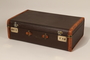 Brown cloth and leather trimmed suitcase used by a young Polish Jewish boy