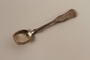 Silver baby's feeding spoon owned by hidden child
