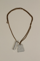 2003.64.2 front
Mezuzah and tombstone pendants on a necklace made by a former concentration camp inmate in a DP camp

Click to enlarge