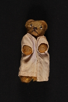 2002.441.5 front
Refugee, a honey brown teddy bear with a pink robe, owned by a young Jewish girl who had lived in hiding as a Catholic

Click to enlarge