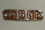 Metal tag with her stamped prisoner number worn as a bracelet by a concentration camp inmate