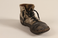 2002.447.1 b front
Pair of toddler's well used black and white leather lace-up boots worn in Theresienstadt ghetto/labor camp

Click to enlarge