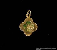 2003.158 front
Gold 4-leaf clover charm buried and recovered postwar by a Hungarian Jewish girl

Click to enlarge
