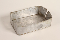 2003.198.3 front
Aluminum food container lid used by a Hungarian Jewish family on the Kasztner train

Click to enlarge