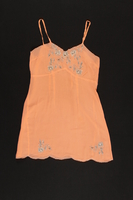 2003.198.5 front
Peach chemise with black and white floral appliques saved by a Hungarian Jewish refugee

Click to enlarge