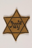 2003.357.1 front
Factory-printed Star of David badge printed with Juif, acquired by a Jewish Lithuanian artist

Click to enlarge