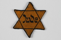 1989.208.3 front
Yellow cloth Star of David badge printed with the word Jude

Click to enlarge