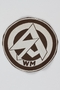 SA sport club patch with a WM monogram and stylized arrow symbol