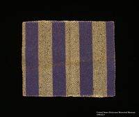 1988.82.4 front
Cloth square cut from a blue and gray striped concentration camp inmate uniform

Click to enlarge