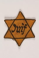 2004.331.2 front
Star of David badge printed Juif worn by a Jew in France

Click to enlarge