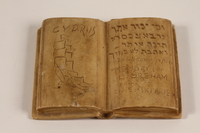 2003.465.3 front
Carved stone book with an inscription made for a British officer by a Jewish internee in Cyprus

Click to enlarge