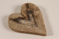 2003.465.4 front
Heart shaped carved stone ashtray acquired by a British officer

Click to enlarge