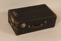 Black flat top steamer trunk used by a Jewish Austrian refugee