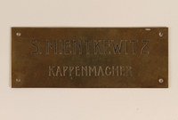 2004.704.4 front
Small brass sign from the family capmaking business brought to the US by a Jewish refugee from Vienna

Click to enlarge