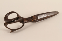 2004.704.6 back
Large black painted fabric shears from the family capmaking business brought to the US by a Jewish refugee

Click to enlarge