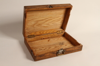 2004.706.8 open
Wooden box with inlaid initials used by a Polish Jew in hiding in the Boryslaw ghetto

Click to enlarge