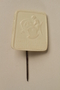 White plastic pin with a mother and baby for a Nazi Party charity drive