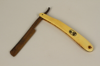 2005.457.6 front
Straight razor used in a concentration camp

Click to enlarge