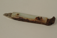 2005.457.16 front
Mother-of-pearl lever arm of a nail clipper used in a concentration camp

Click to enlarge