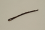 Curved bobby pin used in a concentration camp