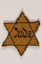 Star of David yellow cloth badge printed with Jude, the German word for Jew