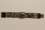 Brass bracelet with cutout designs of scenes of daily life made in Łódź Ghetto