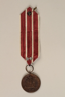 2000.226.6 front
Medal and maroon and white ribbon

Click to enlarge