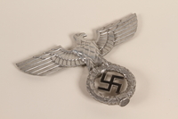 2000.510.2 front
Silver Reichsadler flagpole ornament that was removed from a flagpole

Click to enlarge