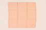 Pale orange handkerchief with a pink monogram carried by a Kindertransport refugee