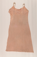 2004.437.2 front
Embroidered pink slip worn while in hiding in Poland

Click to enlarge