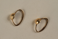 2005.157.1_a-b front
Gold hoop earrings worn by a hidden child in Poland

Click to enlarge