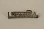 Silver UNRRA pin worn by a former concentration camp inmate and refugee aid worker