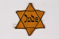 2001.3.4 front
Star of David badge on floral backing printed Jude owned by a Czech Jewish survivor

Click to enlarge