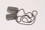 Two dog tags and a chain worn by a Jewish American soldier