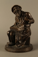 2016.184.2 front
Bronze figurine of a seated Jewish peddler

Click to enlarge