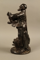 2016.184.3 left side
Bronze figurine of a Jewish man holding a rooster

Click to enlarge